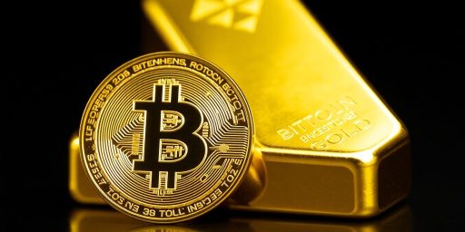Bitcoin coin and gold bar highlighting investment trends.