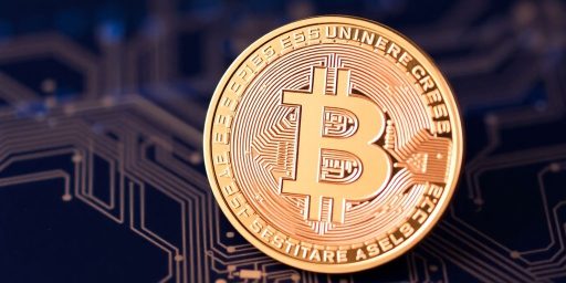 Bitcoin coin on digital circuit background.